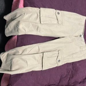 Levi’s, khakis, cargo pockets with button.